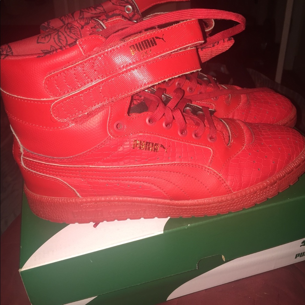 Puma red high top sneakers